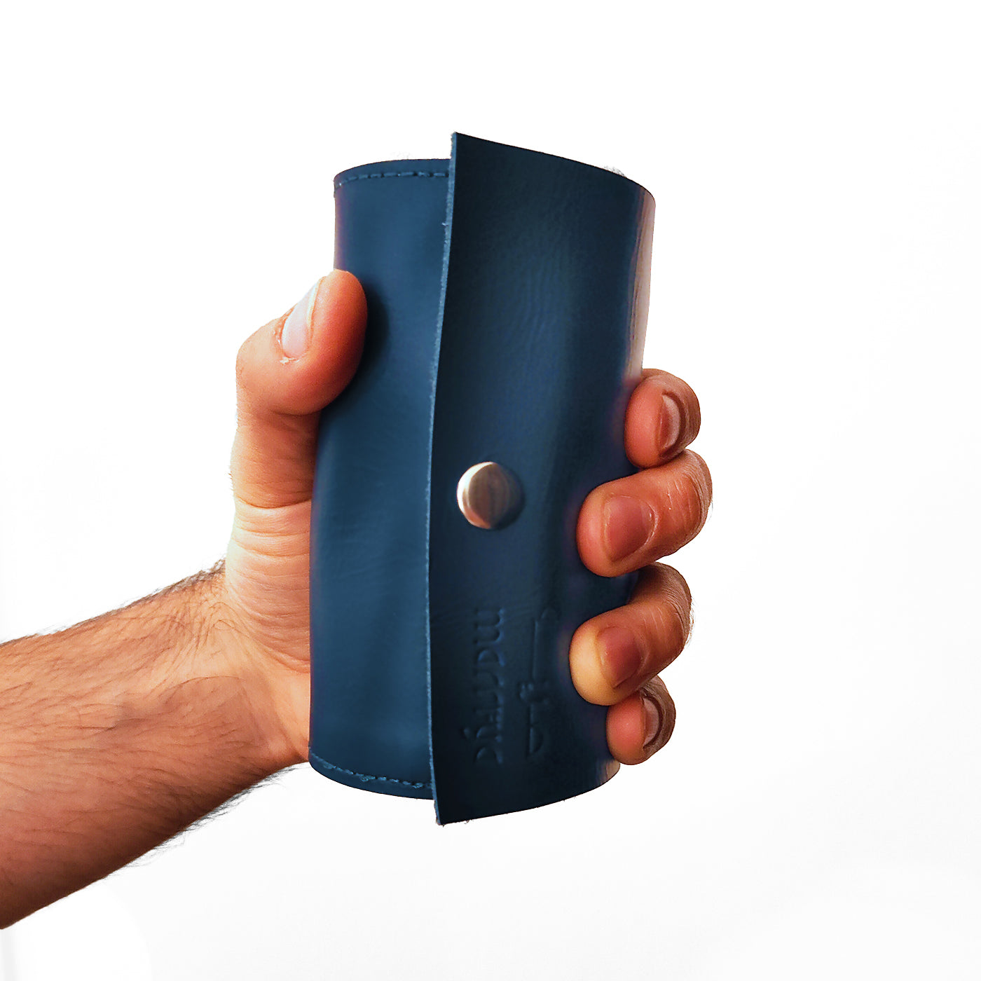 Hand with blue leather mini roll up prayer mat